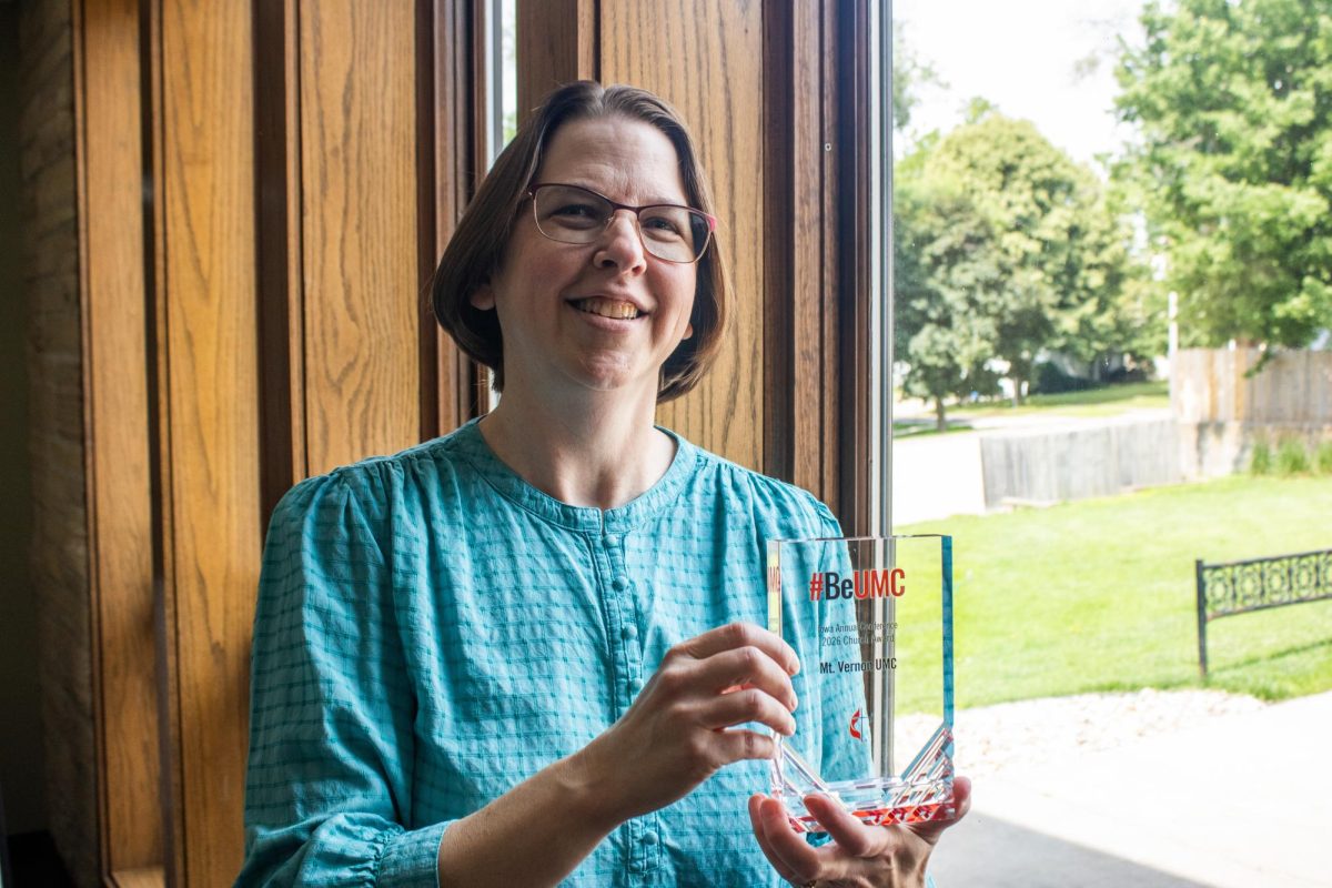 Pastor Vicki Fisher poses for a portrait with the #BeUMC award for best congregation inside of the United Methodist Church of Mount Vernon Tuesday, June 23. 