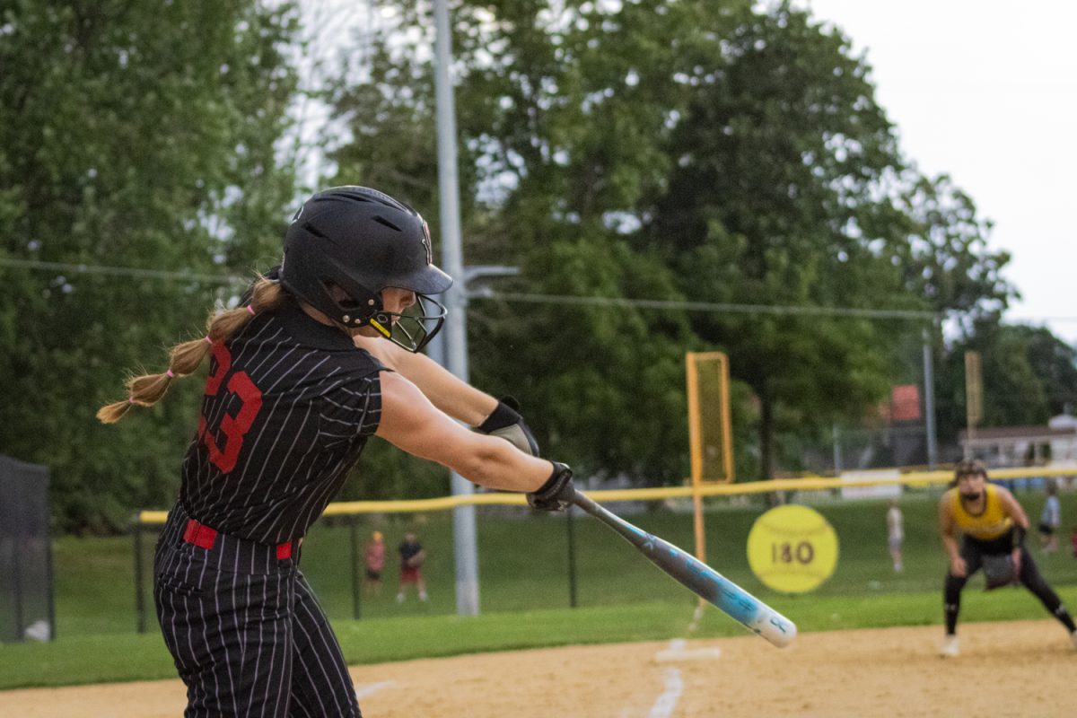 Emma Pleasant mid-swing against Edgewood Colesburg in Lisbon on Thursday, July 2.
