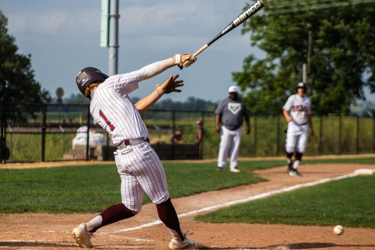 Mount Vernon outfielder Michael Ryan strikes the ball during a baseball game between the Mount Vernon Mustangs and the South Tama County Trojans at Ash Park Baseball Field in Mount Vernon Monday, June 29.