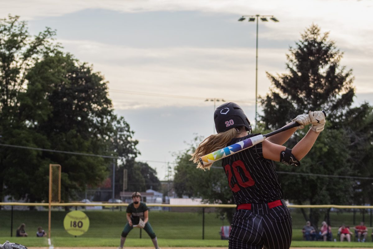 Outfielder Lohgan Anderson mid swing during the regional quarterfinal game against West Burlington-Notre Dame on Wednesday July 8 at Bunting Field in Lisbon.