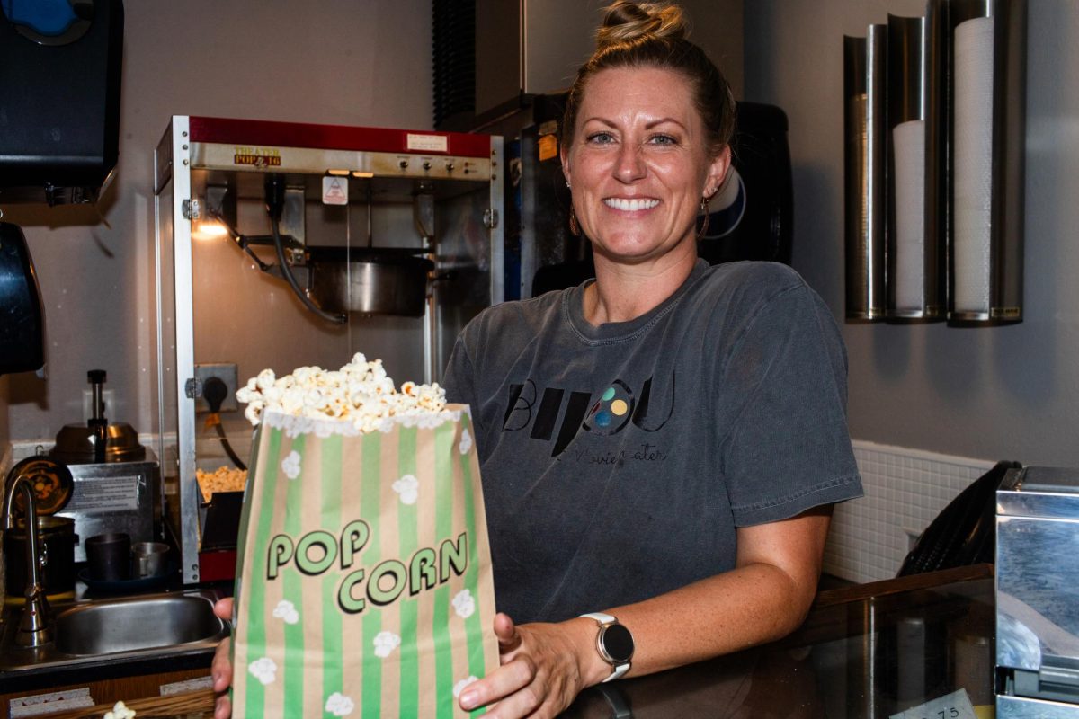 Owner Kelli Kennon-Lane makes popcorn inside of the Bijou Theatre in Mount Vernon on Saturday, July 11, 2026. The Bijou was awarded Business of the Year by the Mount Vernon-Lisbon Community Development Group.