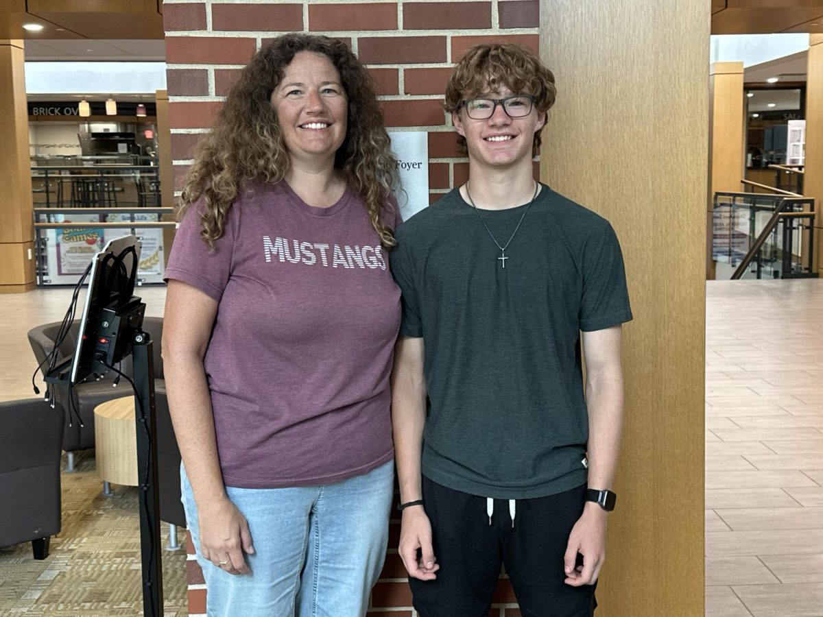 Jessica and Landon Johanningmeier smile while reflecting on this incredible accomplishment at Cornell College — Jessica’s place of work.