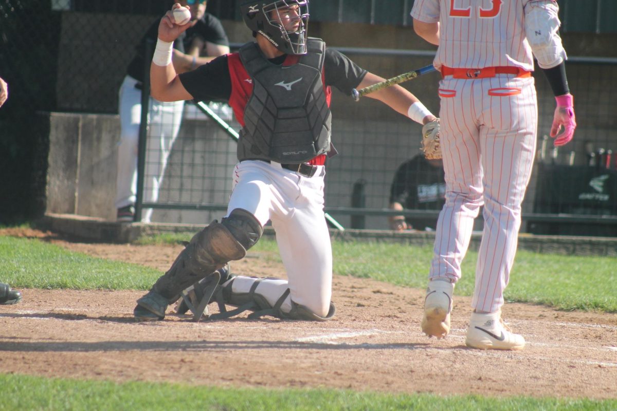 Lisbon’s Ethan Stone fields a wild pitch against Easton Valley.