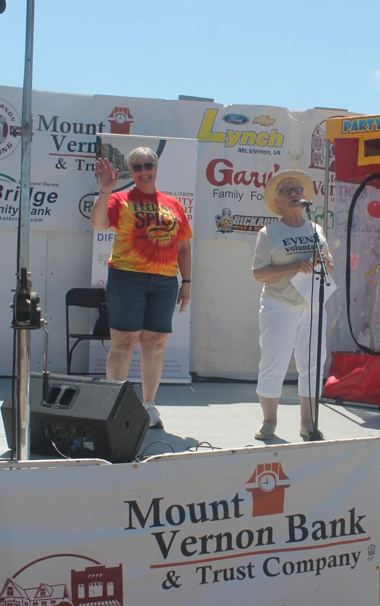 Sue Margheim waves to the crowd at Heritage Days as she’s named Volunteer of the Year Saturday, July 11.