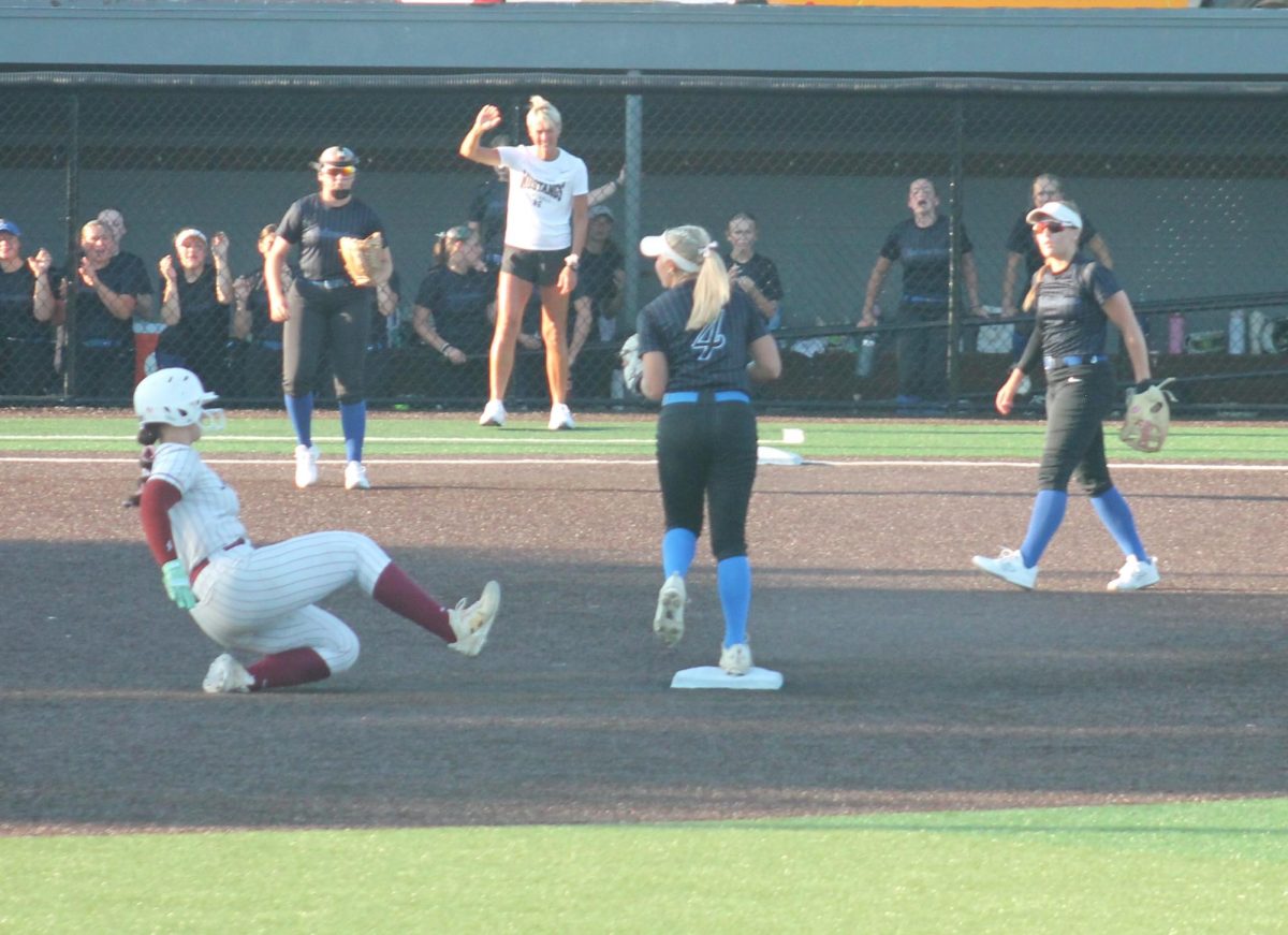 Mount Vernon’s Hayden Gookin (No. 17) tries to slide into second base, but Dike New Hartford already had caught the ball.